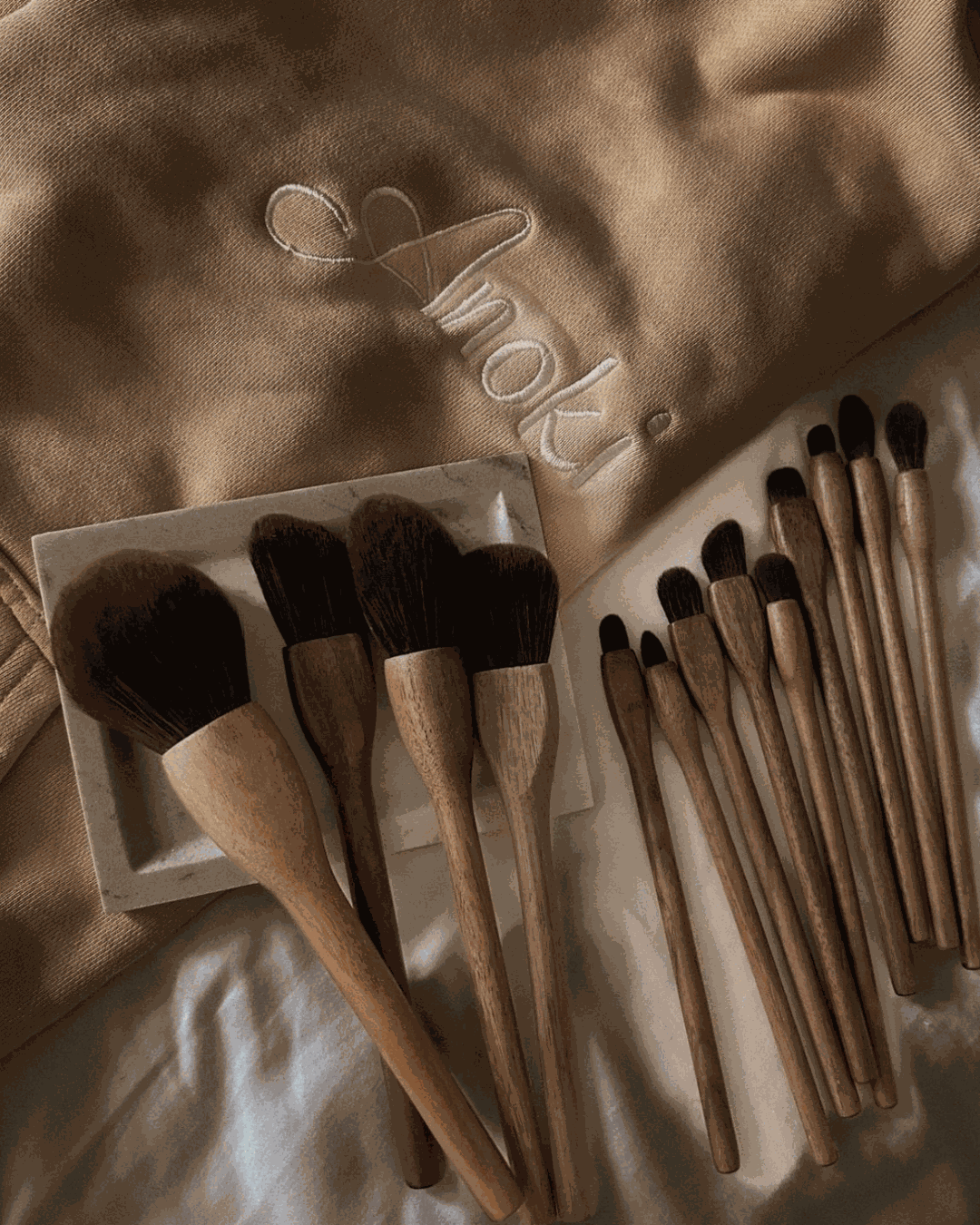 Black Walnut Makeup Brush Set with 13 handcrafted brushes featuring black walnut wood handles and soft synthetic bristles.