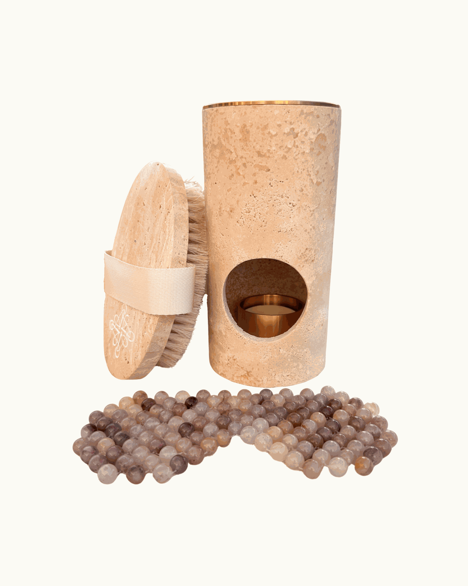 Stone Ritual Set with travertine body brush, jade stone eye mask, and wax melt oil burner for skincare and relaxation